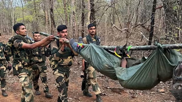 Security forces transporting an injured individual in a Naxal area. | PTI.