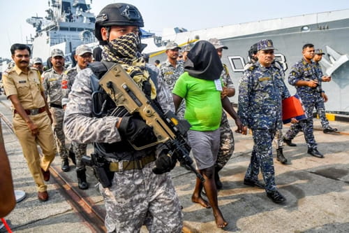 Indian Navy MARCOs bringing the 35 pirates