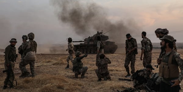 Turkish soldiers gather close to the Syria-Turkey border